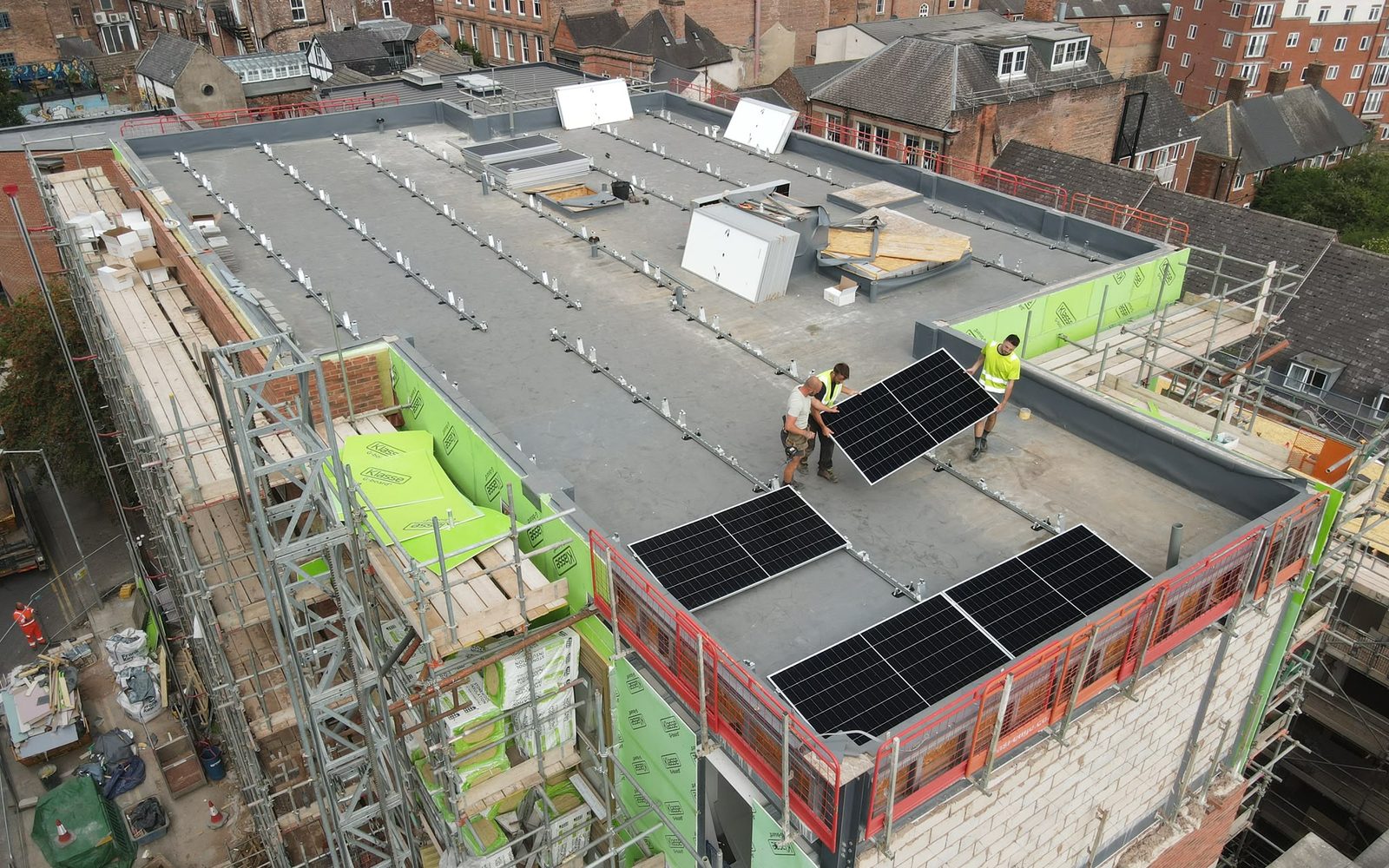 Solvexa engineers installing panels on a commercial roof